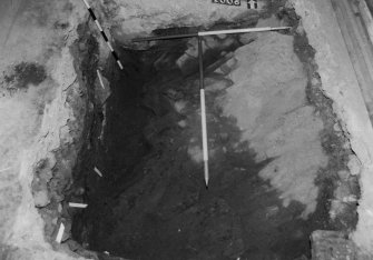 Excavation photograph : area P - wall 1006, along N face of trial hole in SW corner, completely excavated to bedrock.