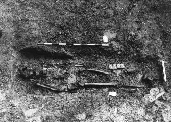 Excavation photograph : area M - skeleton 1103, just to west of 1100 completely excavated..