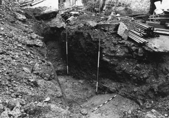 Excavation photograph : area M - f1135 outer ditch, inner edge and fills.