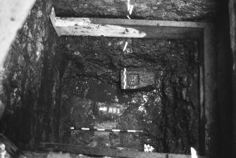 Excavation photograph : area L - finished excavation with wall/pier base under later wall.