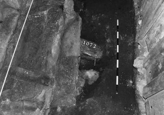 Excavation photograph: area X - NW view of flue arrangement beneath hearth.