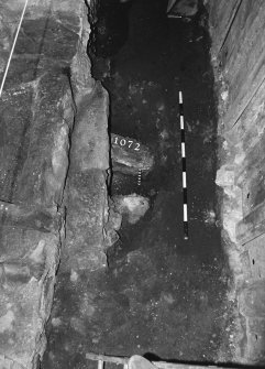 Excavation photograph: area X - NW view of flue arrangement beneath hearth.