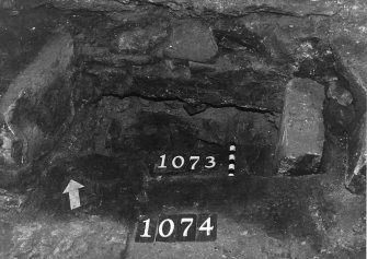 Excavation photograph: area X - fireplace after removal of front stone.