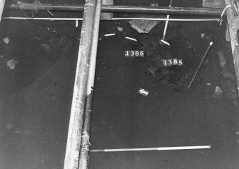 Excavation photograph: area X - general of south end of area, 1385 and 1386 burnt soil.