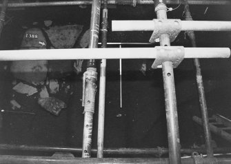 Excavation photograph: area X - flagstones and trench.