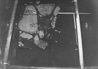 Excavation photograph: area X - flagstones and trench.