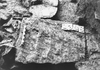 Excavation photograph: area X/H - rippled flagstones within 1388.
