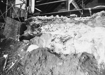 Excavation photograph: area H/X - location of midden material section on bedrock.