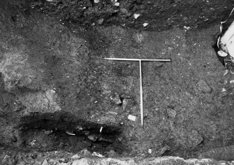 Excavation photograph: area X/H - W side of trench showing ditch to N of Charles II wall.