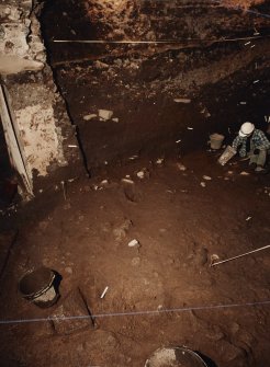 Excavation photograph : area X - excavations after removal of flagstones and cobbles.