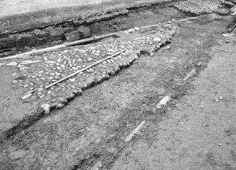 Culross Palace, Fife, Bessie Bar Hall Excavations 1993
Bessie Bar Yard
Frame 2: N end of yard, showing F902, F903, F904, F905, F906, E edge of F907 and F909, from N
Frame 3: Unfocused shot along yard, from N
Frame 4: N end of yard, showing F902, F903, F904, F905, F906, E edge of F907 and F909, from N
Frame 5: same description as 4
Frame 6: same description as 4
Frame 7: Cobbles F901, from W
Frame 8: duplicate of 7
Frame 9: F902/2, from W
Frame 10: F910, F912 and F914, from E
Frame 11: same description as 10
Frame 12: V-shaped drain F911 prior to excavation, from E
Frame 13: same description as 12
Frame 14: Foundations of W wall of palace, from W
Frame 15: E side of yard, from S 
Frame 16: Junction of drains F911 and F914, from S
Frame 17: General view along yard, from S
Frame 18: Cobbles F915, from W
Frame 19: F911 after removal of pipe and fill, from N
Frame 20: General view of yard, from S
Frame 21: F911 after removal of pipe and fill, from W
Frame 22: same description as 21
Frame 23: F911 after removal of pipe and fill, from W
Frame 24: E side of yard, from S
Frame 25: F904 with ceramic pipe in situ, from N
Frame 26: E edge of F911 with F901 in foreground, from W
Frame 27: W side of yard after removal of sand bed, exposing F922, from E
Frame 28: same description as 27
Frame 29: NW corner of yard, from N
Frame 30: Drain F914 and cobbles F910, from E
Frame 31: Drains F914 and F911, from E
Frame 32: same description as 31
Frame 33: Drains and cobbles
Frame 34: View along yard, from N
Frame 35: View along yard, from S
Frame 36: F925, from W
Frame 37: same description as 36