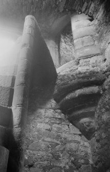 Interior view of Mains Castle, Caird Park, Dundee, showing detail of spiral staircase and corbel decoration.