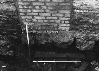 Jedburgh Abbey excavation archive 1985
Frame 5: Ashlar masonry belonging to the abbey's reredorter lying below the W wall of No.4 Abbey Bridge End. From W.

