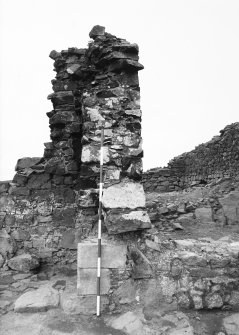 Excavation photograph - fireplace 2 - W side from N; blocked window 25 on right