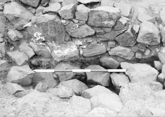 Excavation photograph - W face of wall 4 at Junction with N barmkin wall