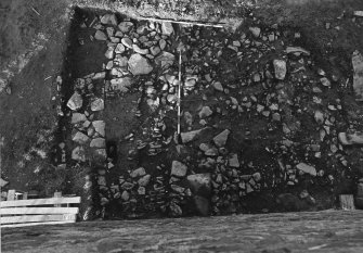 Excavation photograph : trench C - field wall, cobbled surface and wall (F15-17).