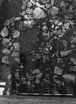 Excavation photograph : trench C - south west corner of trench showing wall F15, cobbles F16 and mortared wall F17.