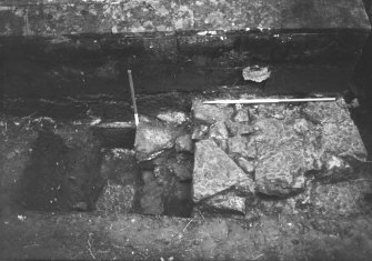 Yester, St Bathan's Chapel (Yester Chapel): Excavation photograph - Wall footings in the N end of Trench 4 - from E