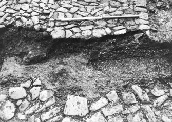Excavation photograph : trench 2 showing close up of boulders and clay, from W.