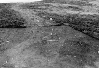 Excavation photograph : area 1, general of stoney surface f102, from SW.