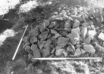 Excavation photograph : area III - heap of stone from rampart (to give idea of quantity)