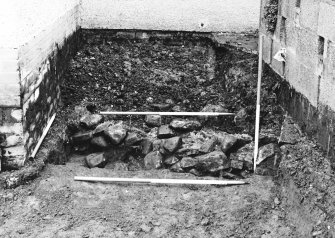 Excavation photgraph : rubble foundations from south.