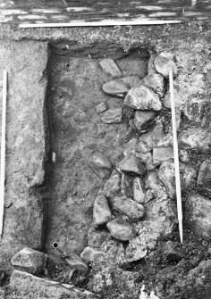 Excavation photgraph : close up of rubble foundations from east.