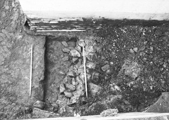 Excavation photgraph : rubble foundations from east.