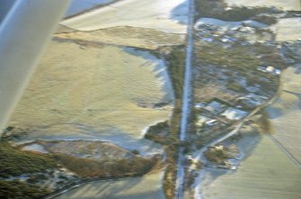 An oblique aerial view of Cartomie Wood, Edderton, Ross and Cromarty, looking SE.