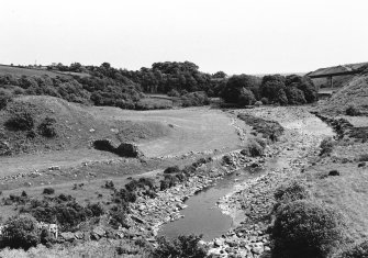 View back down river with ancient crosswall in middle distance left.