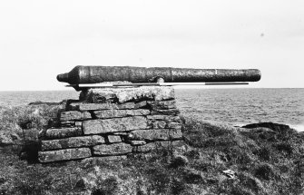 Gun on modern stone base.