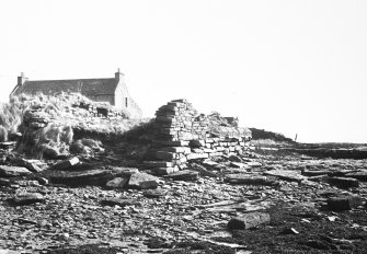 Gneral view from SW, also showing ruined building at head of pier.