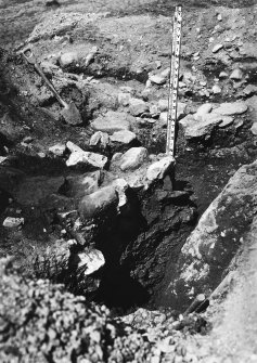 View of excavation trench through walls A, B and C, with rock face