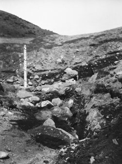 View of excavation trench through walls A, B and C, and cross trench.