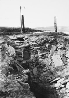 Excavation Photograph: Limpet box etc. in hut 6.