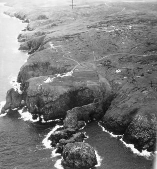 General oblique aerial view centred on the lighthouse, taken from the NW.