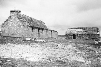 Relationship of farmhouse to outbuildings.