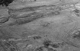 Aerial photograph showing 'Usshilly Hillock - broch, field system and drainage'.  Origin unknown - part of R J Mercer Caithness survey archive.