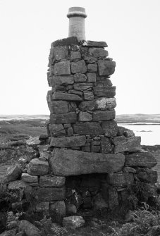 General view of cottage chimney remains.