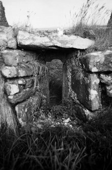 View of window on N wall of southern chapel from interior.