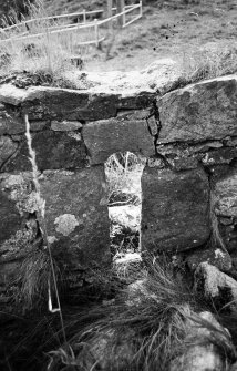 View of window on N wall of southern chapel from exterior.