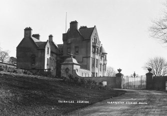 Copy of historic photograph showing view from NW.