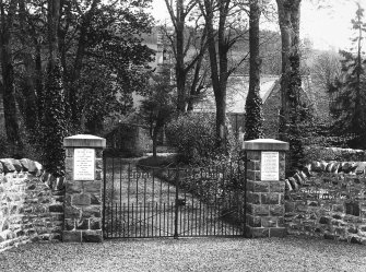 Copy of historic photograph showing view of gateway.