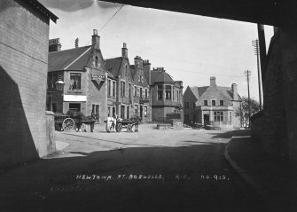 Copy of historic photograph showing view from under bridge.