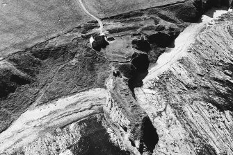 Dundarg Castle, promontory fort: oblique air photograph.