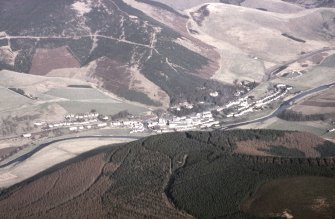 Oblique aerial view centred on village from SW.