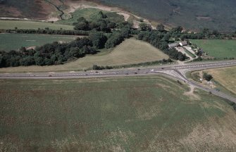 Aerial view of junction with A96 and Barn Church Road, eastern outskirts of Inverness, looking N.