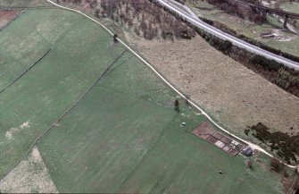 An oblique aerial view of Raigbeg, Moy and Dalarossie, Inverness, looking SSW.