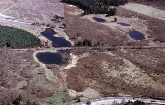 An oblique aerial view of Loch nan Carraigean, Duthil and Rotheirmurchus, Badenoch and Strathspey, looking E.