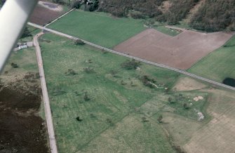 An oblique aerial view of Chapleton, Boat of Garten, Duthil and Rothiemurchus, Badenoch and Strathspey, looking WNW.